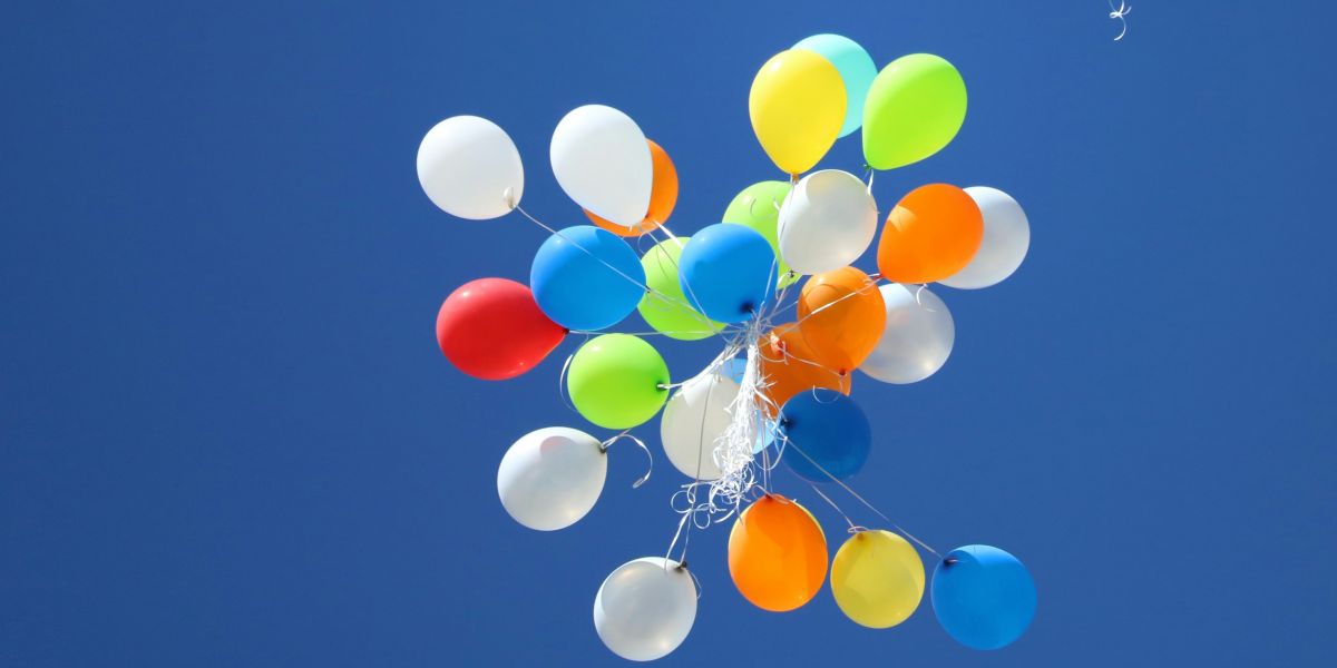 balloons flying away